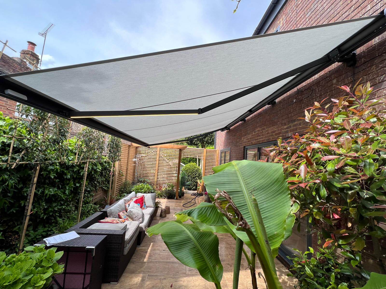 Awnings and canopies in garden behind the building