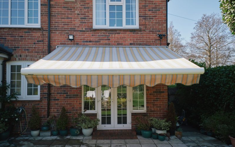 Yellow and White Strip Full Cassette Awning